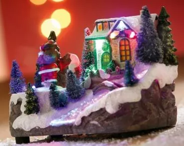 18 cm große Spieluhr mit einer Winterlandschaft aus Kunststein mit Wechsel-LED
